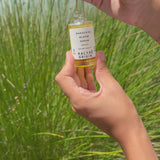 Bakuchiol Bloom Serum anti-âge lissant certifié COSMOS ORGANIC 30 ml avec pipette présenté en extérieur – KALYAË ORIGIN